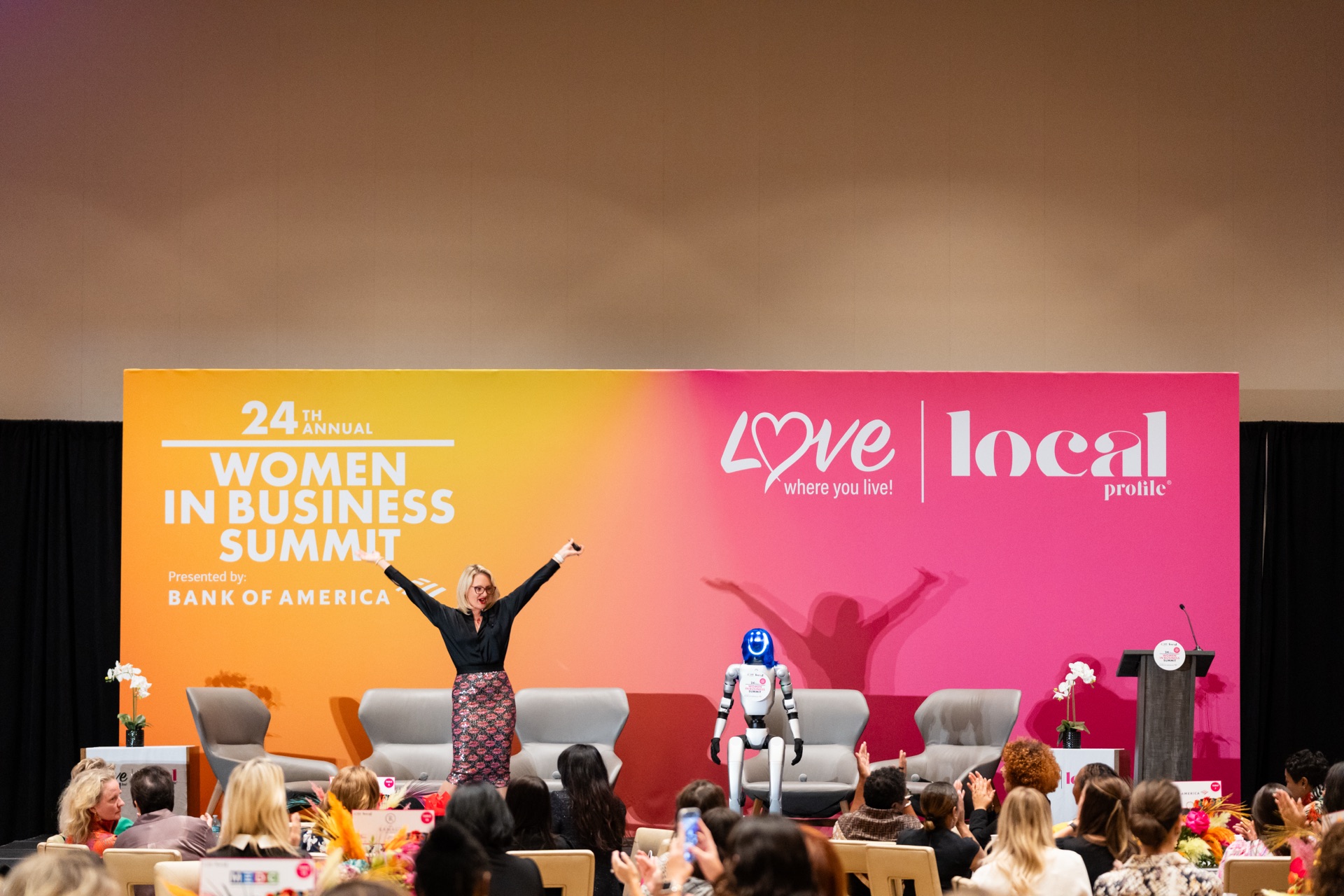 Rebecca Silvestri speaking on stage at the Women in Business Summit